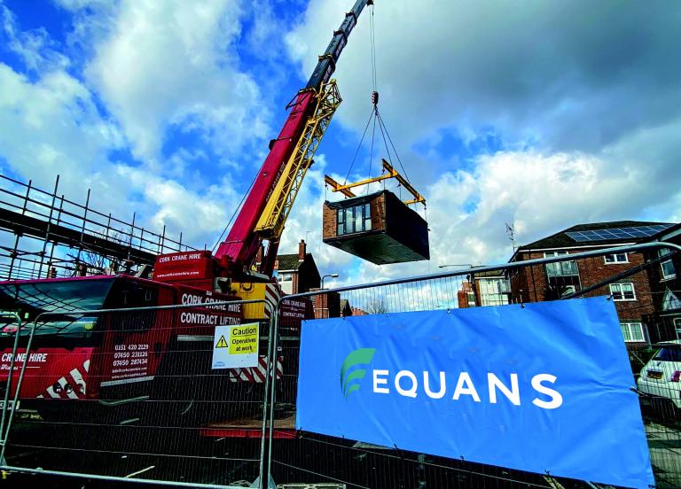 A crane delivering an off site manufactured modular housing solution