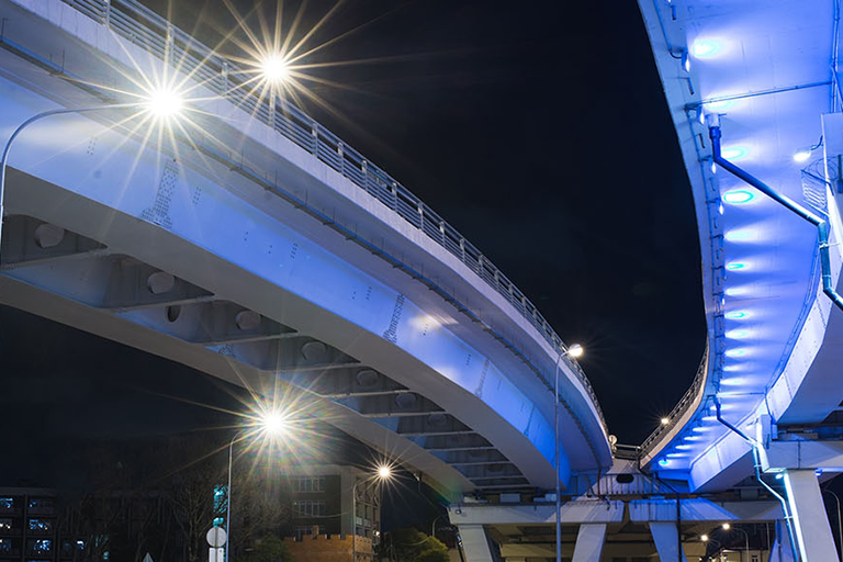 Image of street lights under bridge