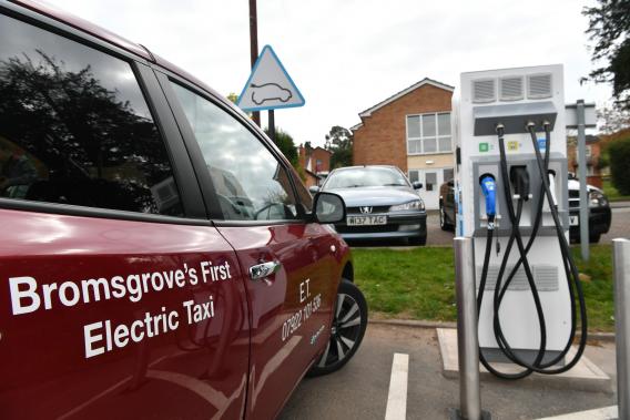 Bromsgrove first electric taxi parked next to charge point