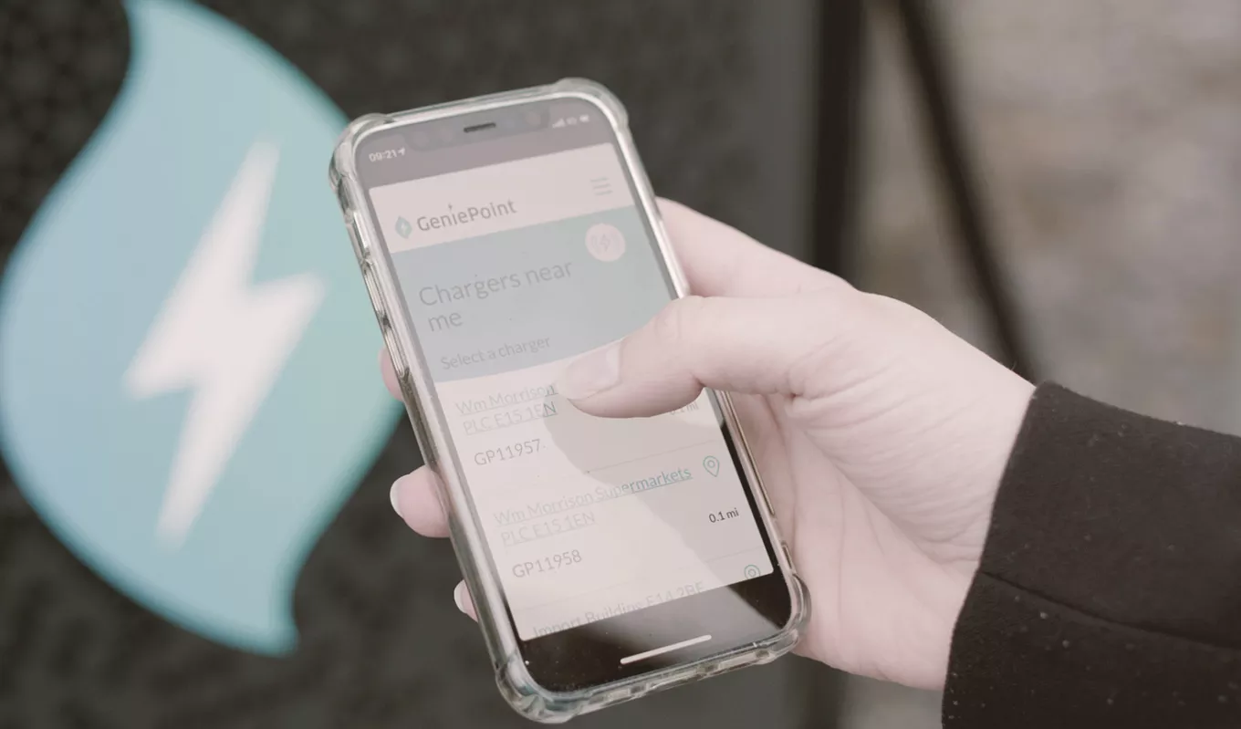 person using Genie Point charging app on mobile phone