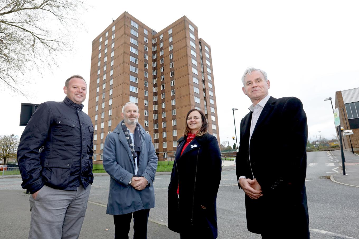 Key stakeholders stood in front of tower block in the West Denton area of Newcastle,
