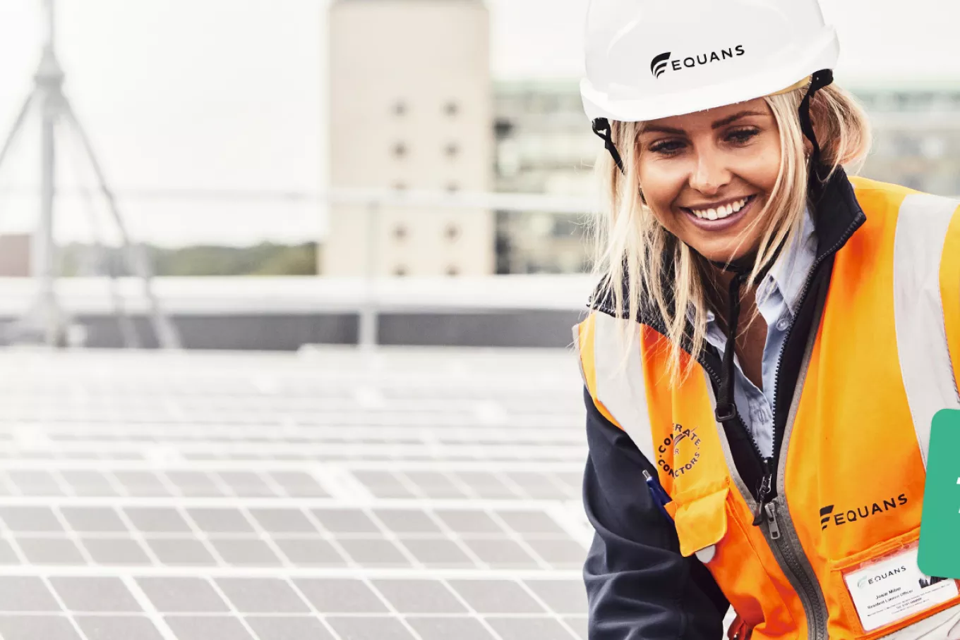 Equans employee standing next to roof top solar in Newcastle