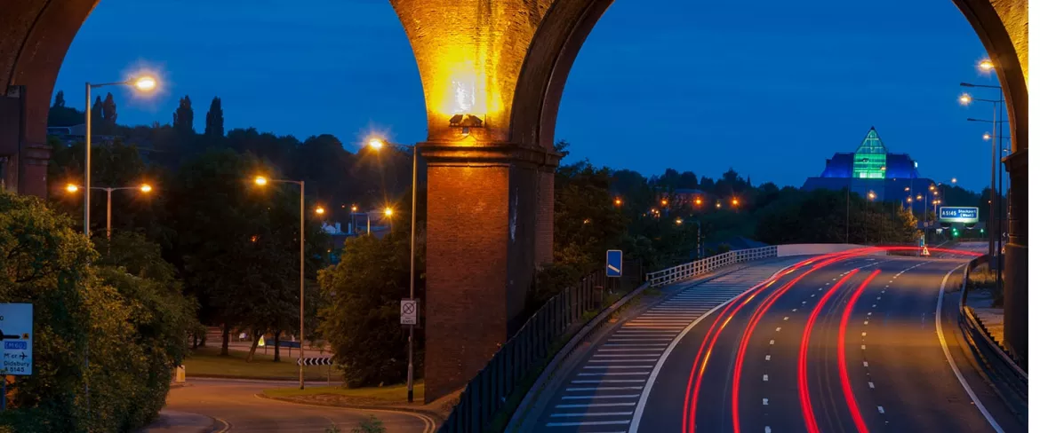 Road going under bridge