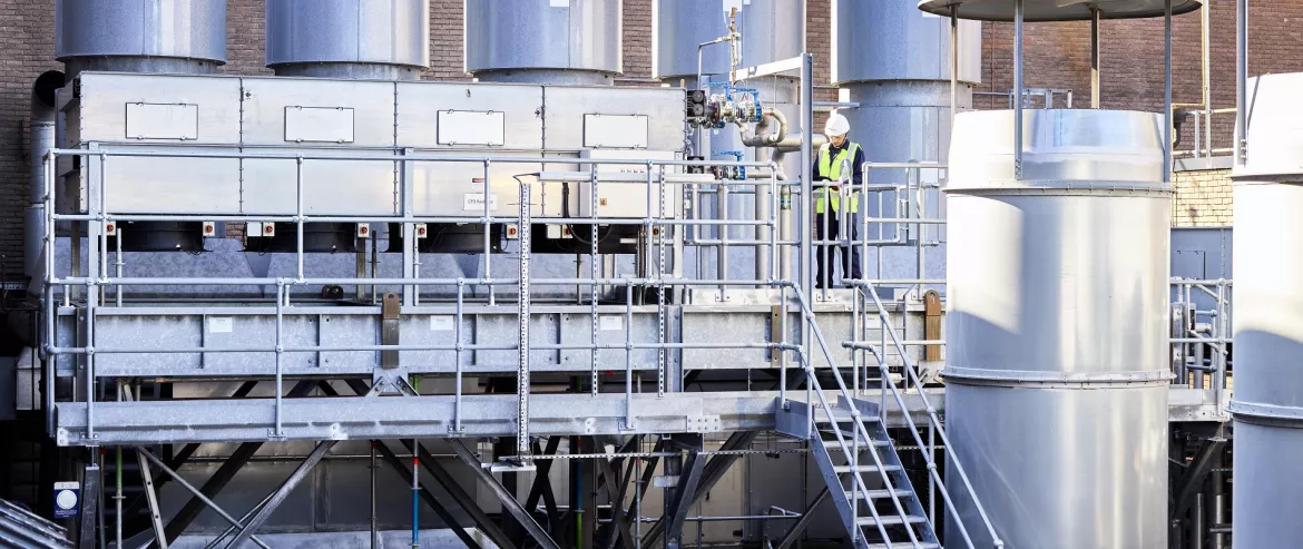 Equans employee inspecting industrial plant