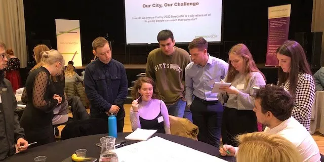 people collaborating in workshop