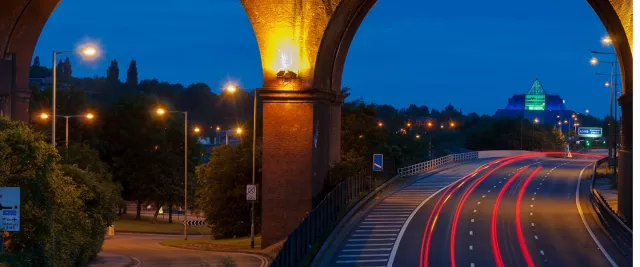 Road going under bridge