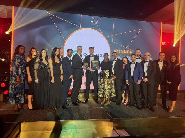 Group shot of the Equans team collecting one of the trophies secured at the Building the Future Awards Ceremony