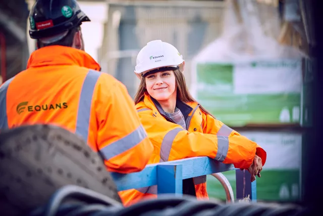 Two Equans employees stood talking onsite at North Sighthill in Ediburgh