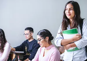 three students - one stood, two sat