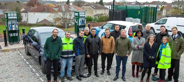 Key stakeholders standing in front of EV charger on Bristol's Revive network