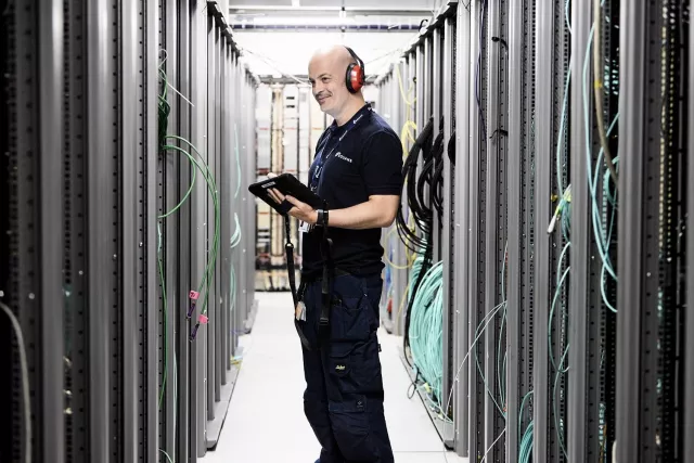 Equans employee undertaking maintenance in a data room