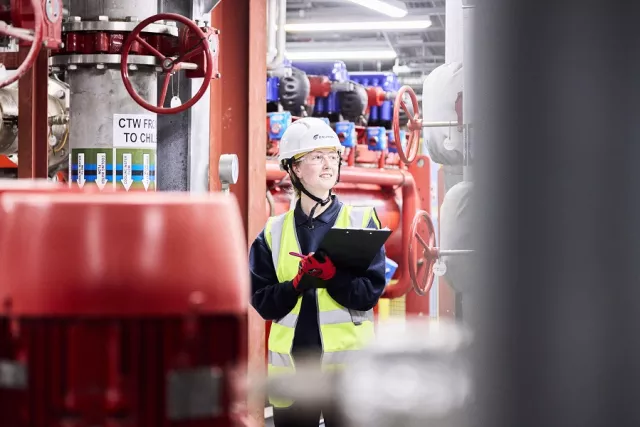 Equans employee inspecting industrial plant
