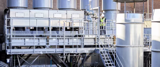 Equans employee inspecting industrial plant