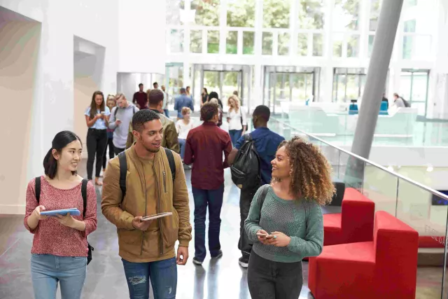 Several students wandering through atrium