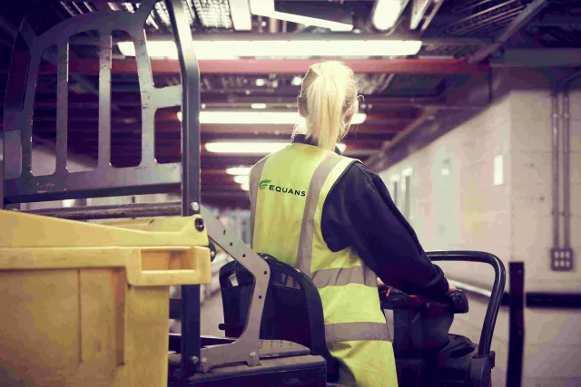 a female Equans employee driving a vehicle at Pinderfields hospital