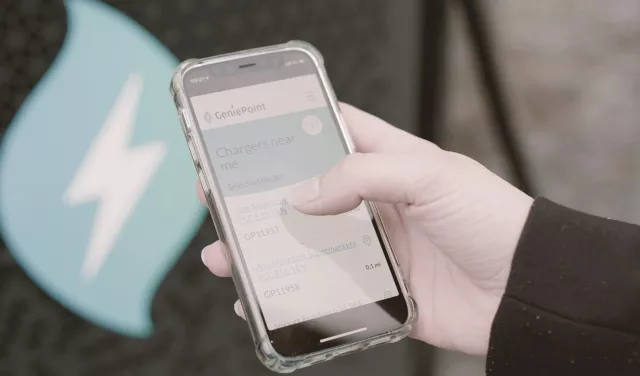 person using Genie Point charging app on mobile phone